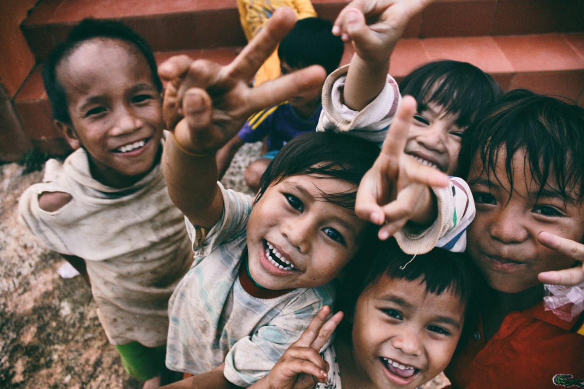Children smiling at a community programme